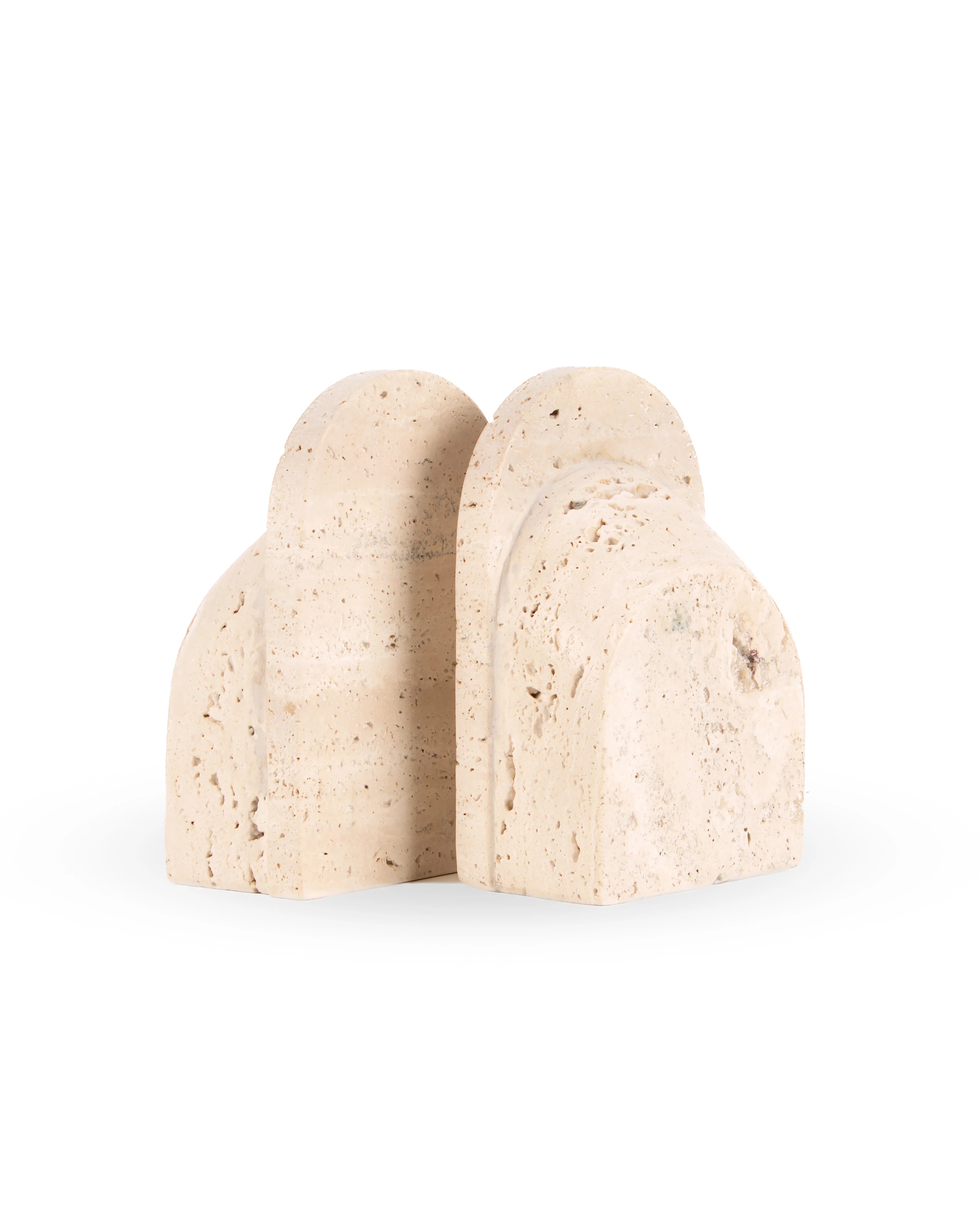 A pair of natural travertine stone bookends with a textured, speckled beige surface, shown on a clean white background.