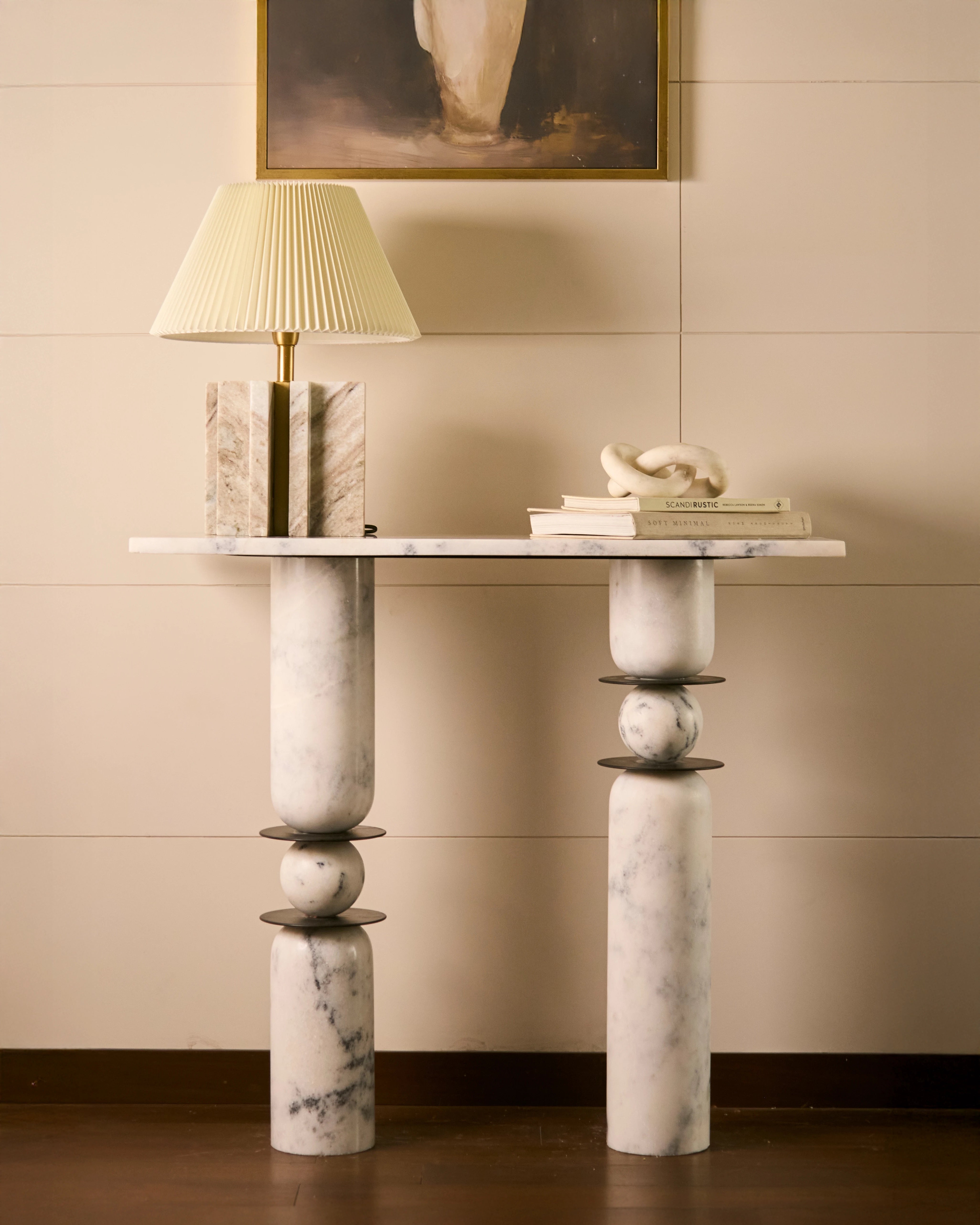 Luxury marble console table with sculptural pedestal legs and handcrafted stone details
