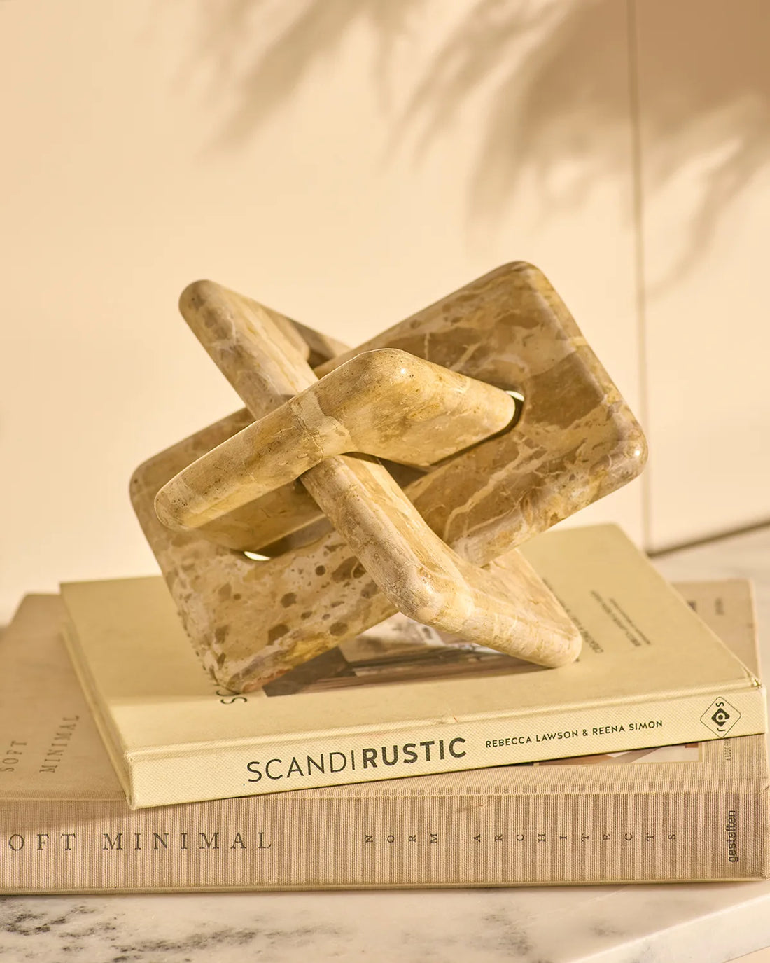 Handcrafted marble chain sculpture in natural stone for luxury coffee table styling